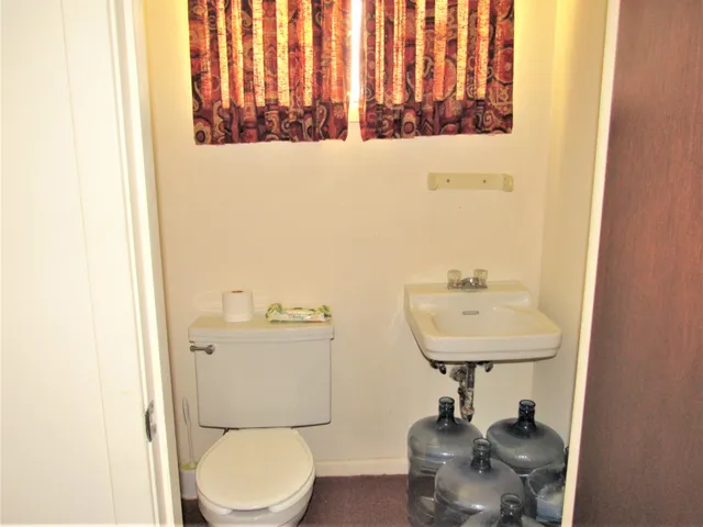 a bedroom with a bed and flat screen tv