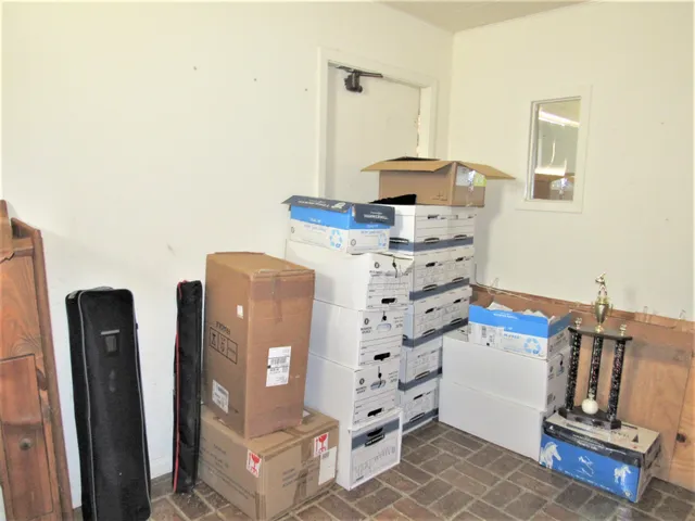 a bathroom with a black and white checkered floor