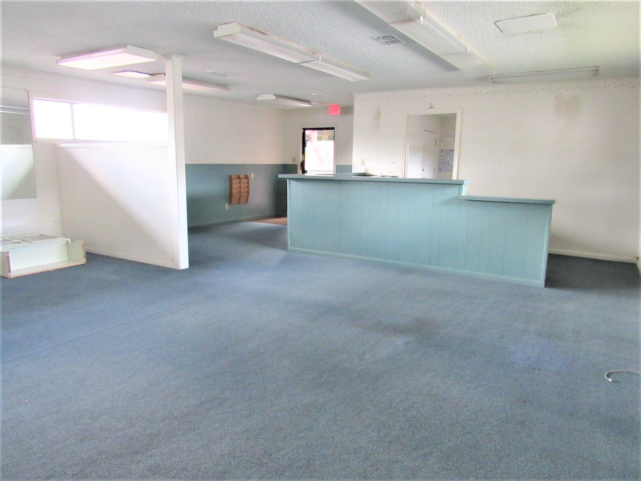 1116 North Fulton Street Wharton, TX 77488 - Photo 3 of 45 a view of a kitchen with a sink and dishwasher cabinets