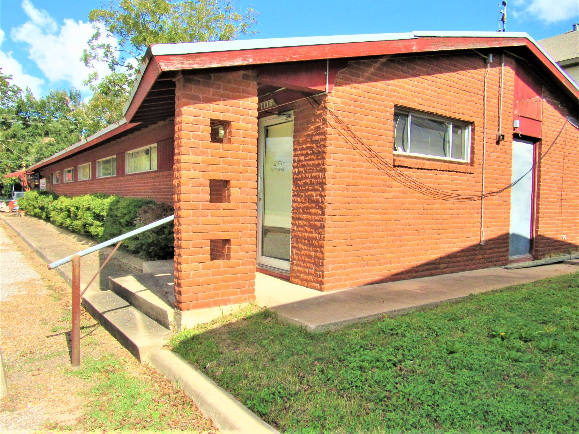 1116 North Fulton Street Wharton, TX 77488 - Photo 34 of 45 a view of a house with a backyard