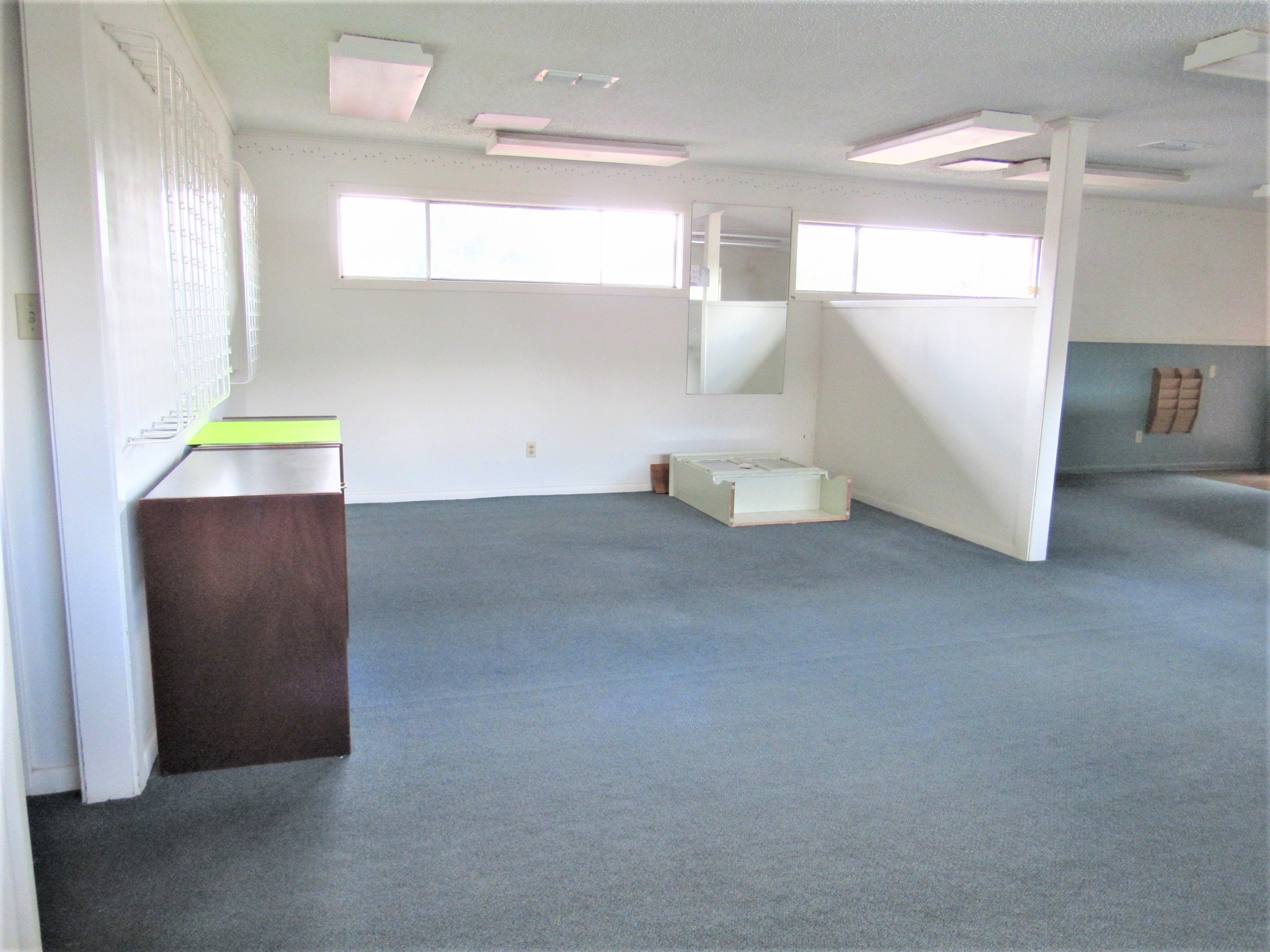 1116 North Fulton Street Wharton, TX 77488 - Photo 4 of 45 a view of an empty room with window and stairs