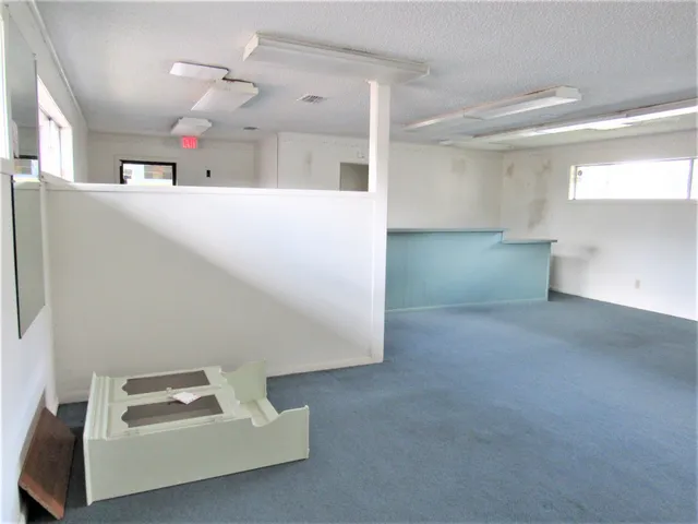 a room with cabinets and window