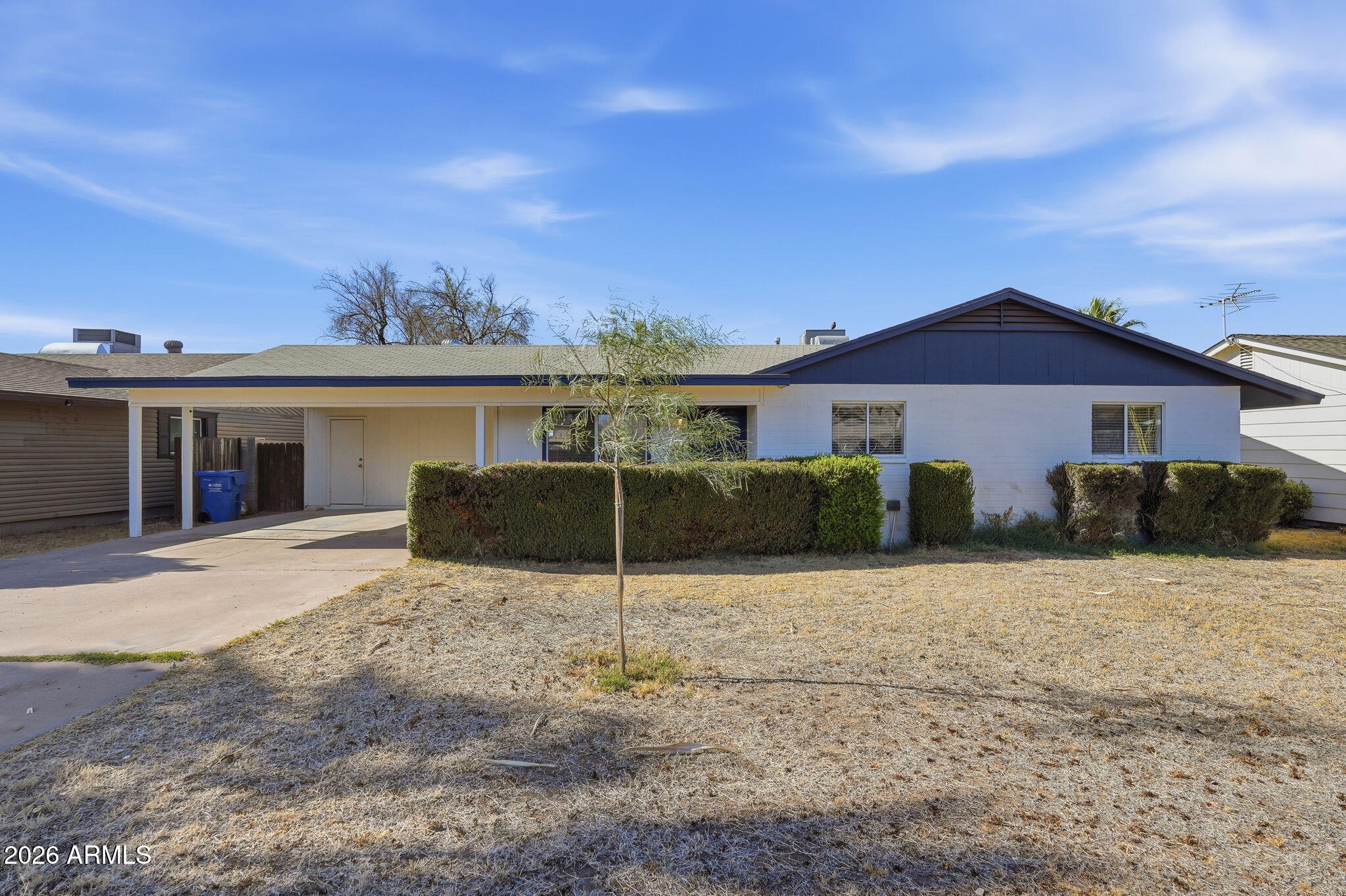 2302 East Nisbet Road Phoenix, AZ 85022 - Photo 1 of 22 a front view of a house with a yard