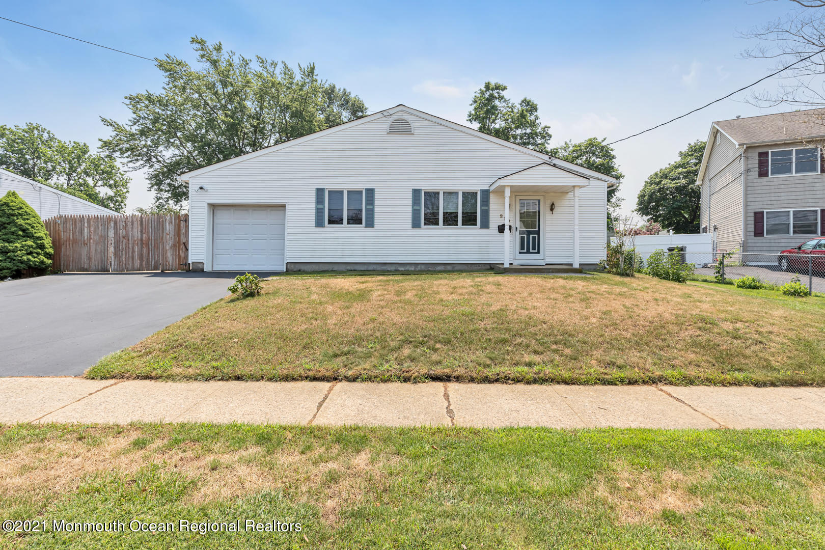 210 Middle Road Hazlet, NJ 07730 - Photo 2 of 30 a front view of a house with a yard and garage
