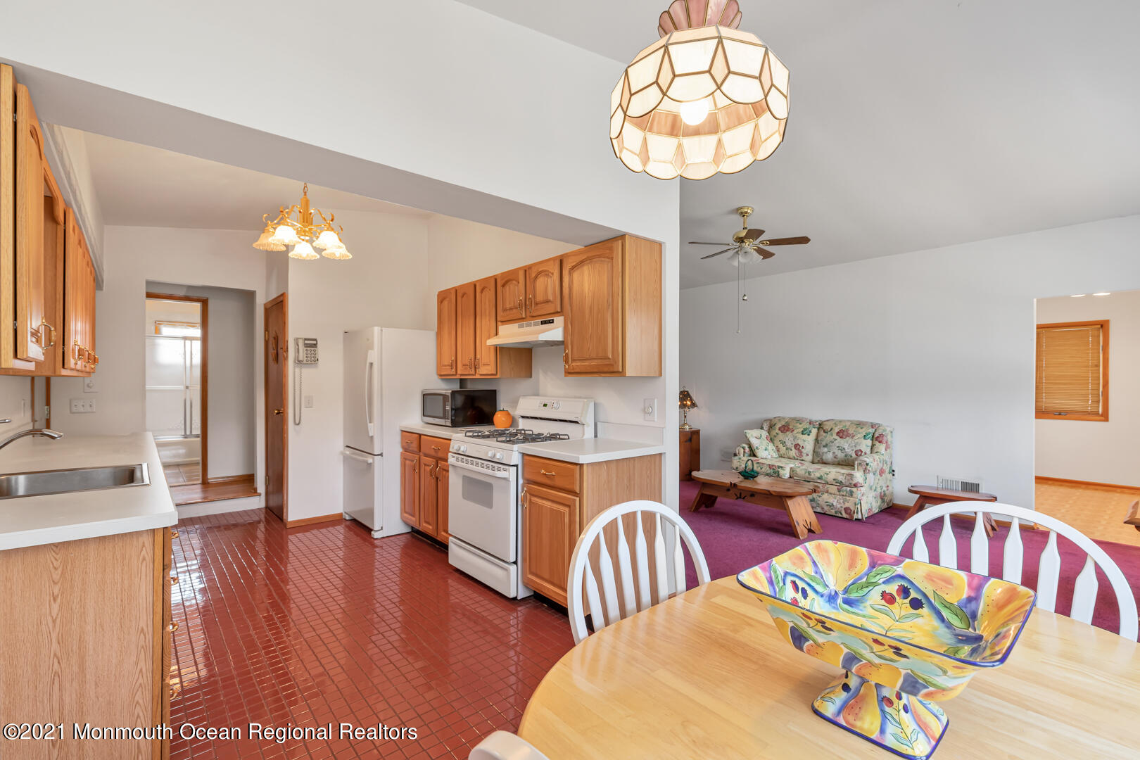 210 Middle Road Hazlet, NJ 07730 - Photo 11 of 30 a living room with stainless steel appliances kitchen island granite countertop furniture and a wooden floor