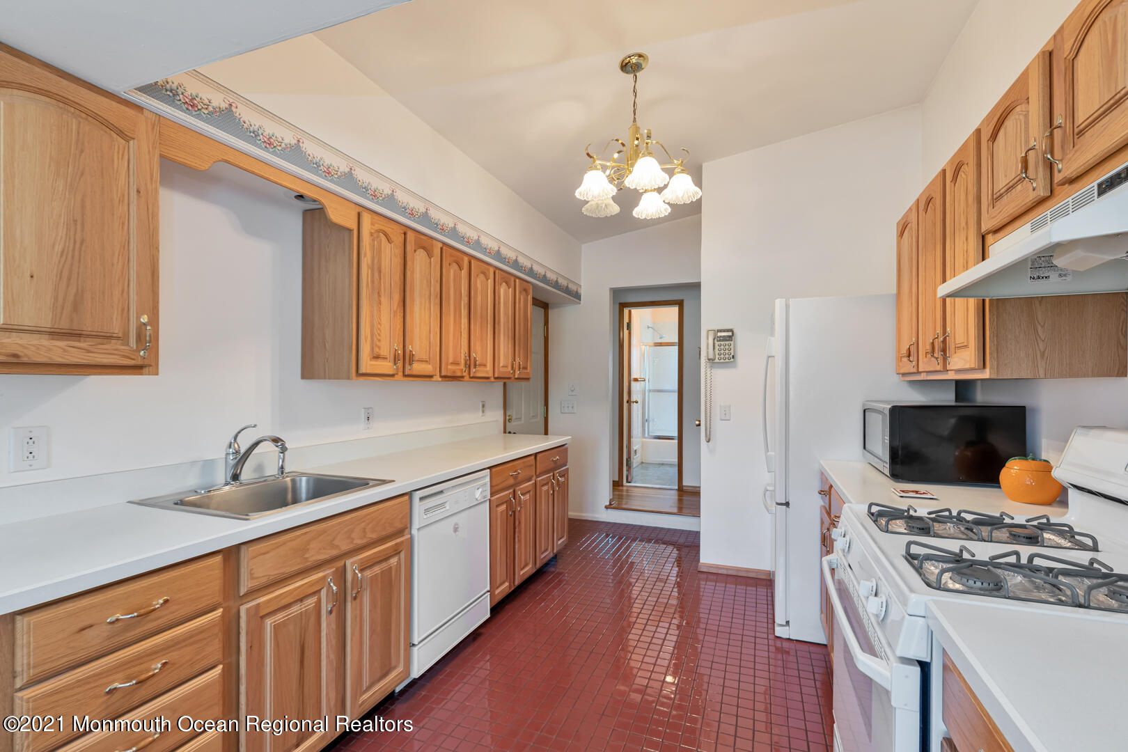 210 Middle Road Hazlet, NJ 07730 - Photo 12 of 30 a kitchen with stainless steel appliances granite countertop a sink stove and refrigerator