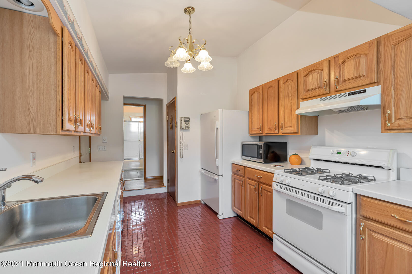 210 Middle Road Hazlet, NJ 07730 - Photo 13 of 30 a kitchen with stainless steel appliances granite countertop a sink stove and refrigerator