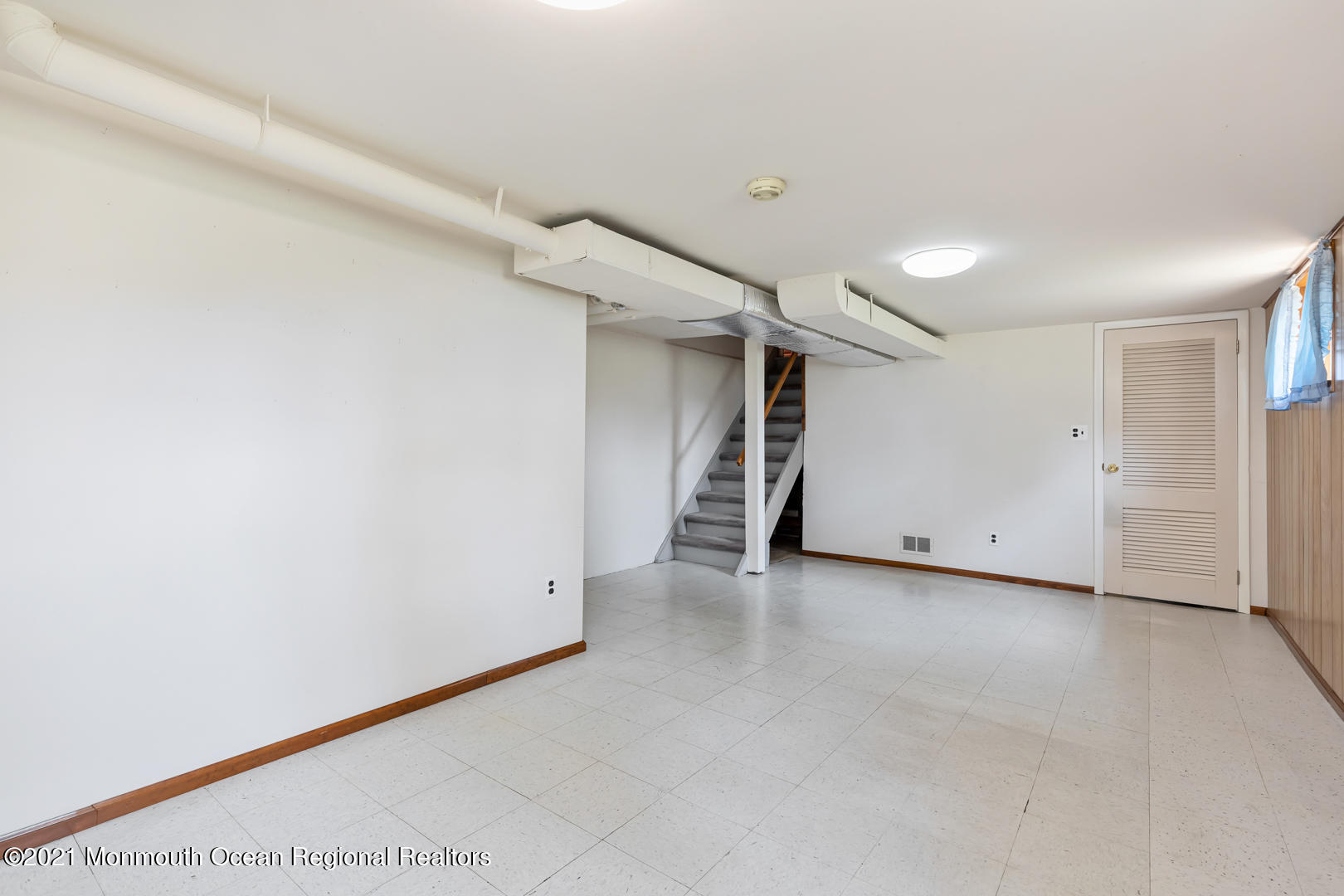 210 Middle Road Hazlet, NJ 07730 - Photo 24 of 30 an empty room with a white wall & door