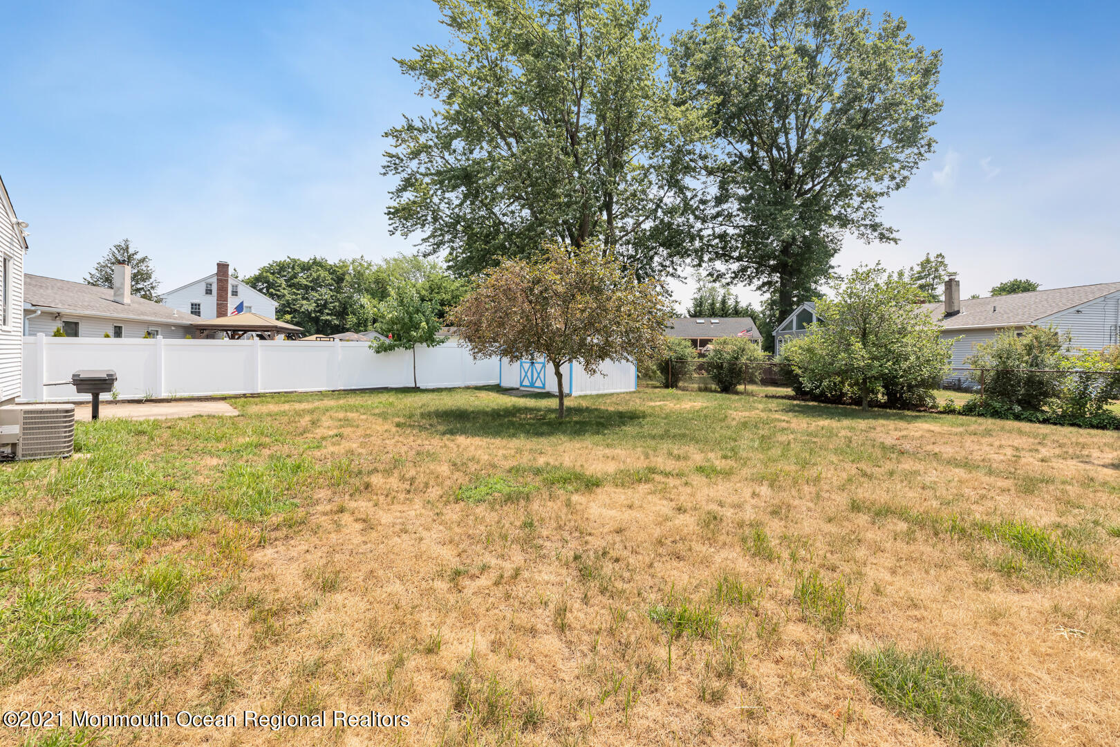 210 Middle Road Hazlet, NJ 07730 - Photo 26 of 30 a view of a swimming pool with a yard