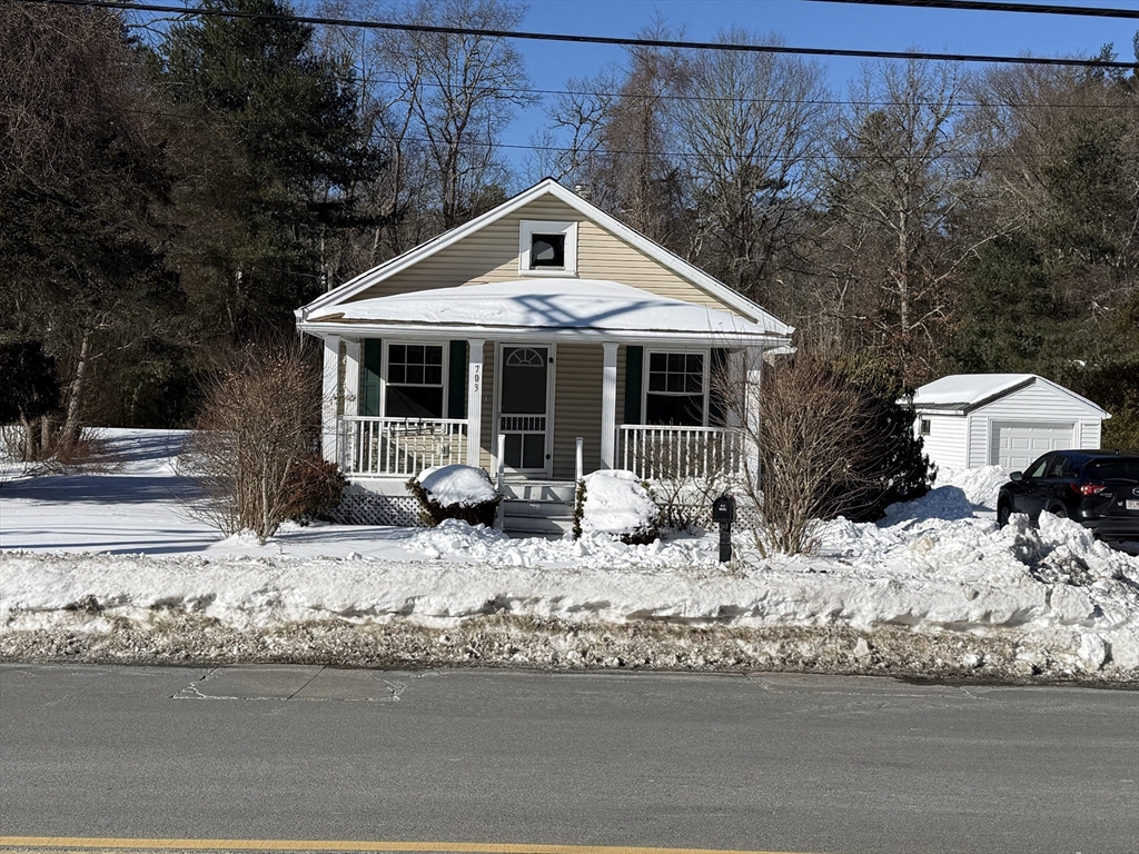 703 Mill Street Marion, MA 02738 - Photo 2 of 20 a front view of a house with yard covered in snow