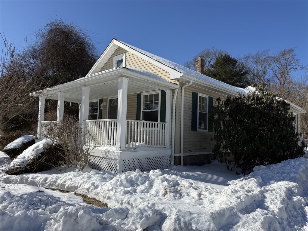 703 Mill Street Marion, MA 02738 - Photo 3 of 20 a view of a house with a yard and plants