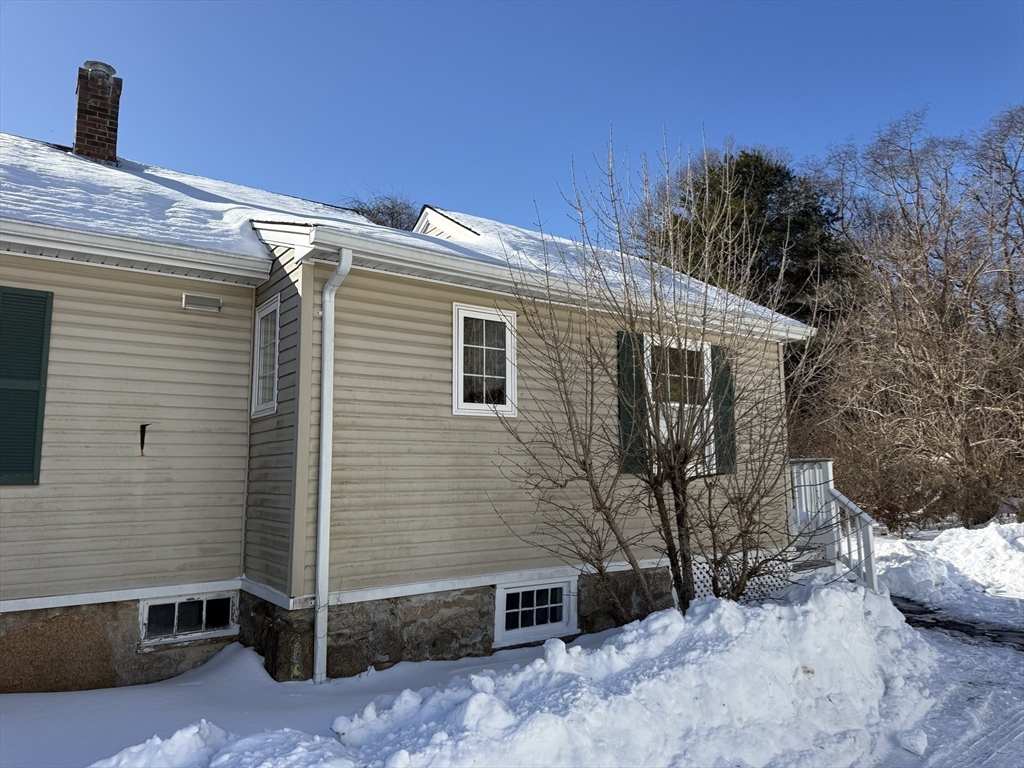 703 Mill Street Marion, MA 02738 - Photo 4 of 20 a view of a house with a yard