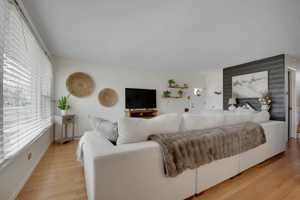 a living room with furniture and a large window