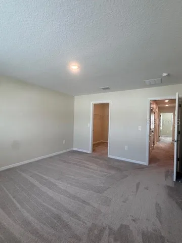 a spacious bathroom with a double vanity sink toilet and shower