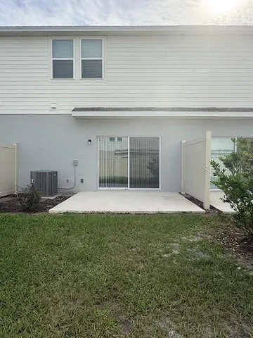 a view of a house with a yard and garage