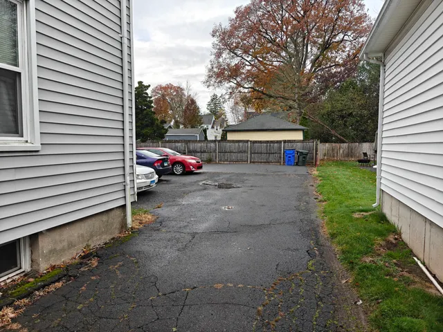 a view of a house with a yard and garage