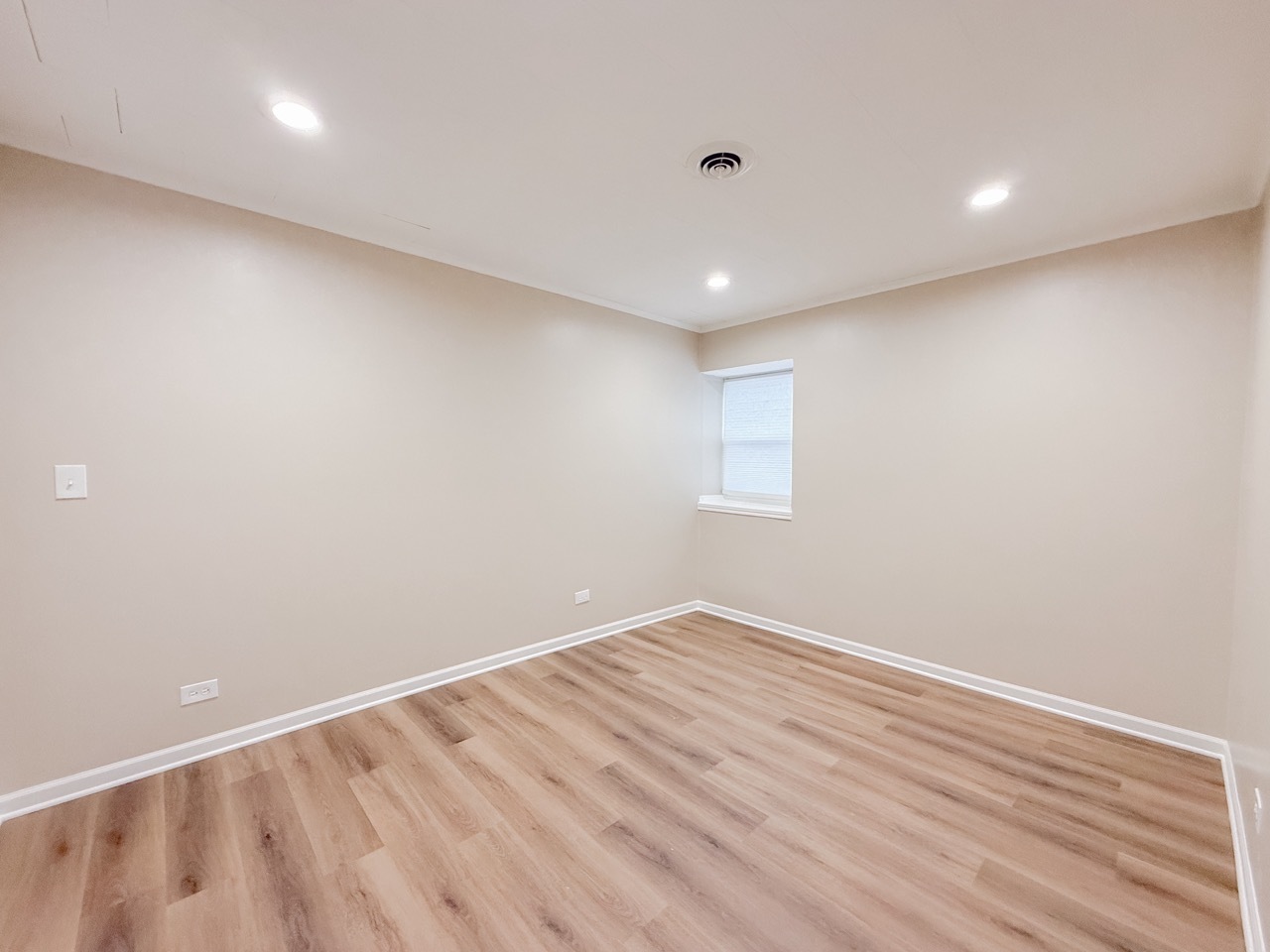 106 East State Road, Unit 2B Island Lake, IL 60042 - Photo 14 of 18 an empty room with wooden floor and windows