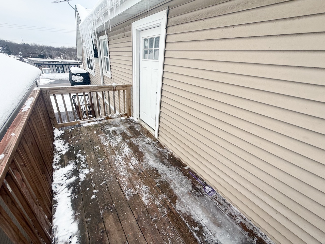 106 East State Road, Unit 2B Island Lake, IL 60042 - Photo 17 of 18 a view of a balcony with wooden floor