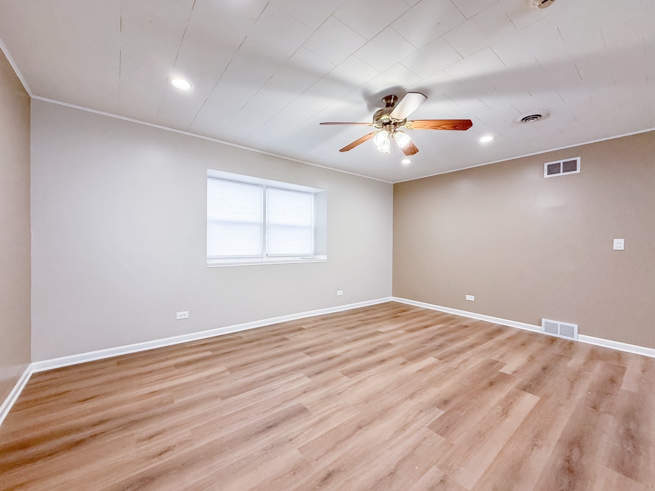 106 East State Road, Unit 2B Island Lake, IL 60042 - Photo 6 of 18 wooden floor in an empty room with a window