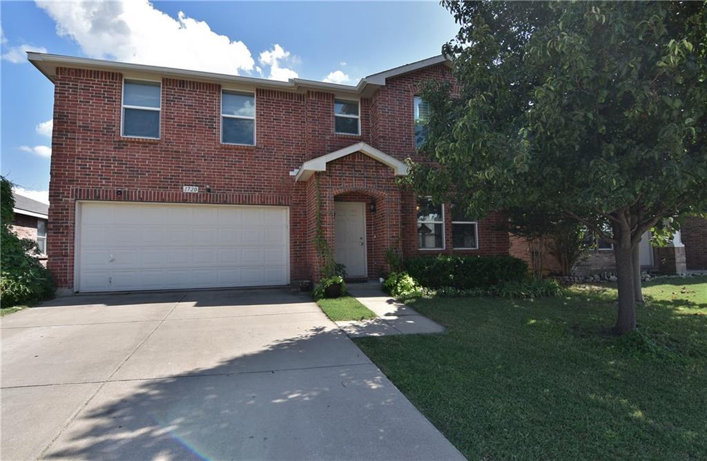 1720 Carolina Ridge Way Fort Worth, TX 76247 - Photo 1 of 1 a front view of a house with a yard and garage