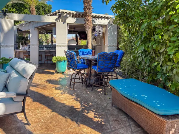a view of an outdoor sitting area with furniture