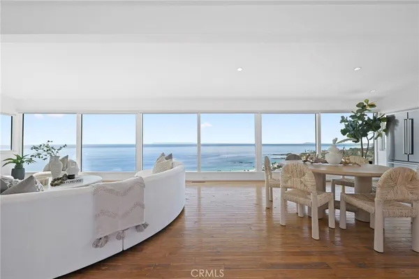 a living room with furniture a window and a dining table