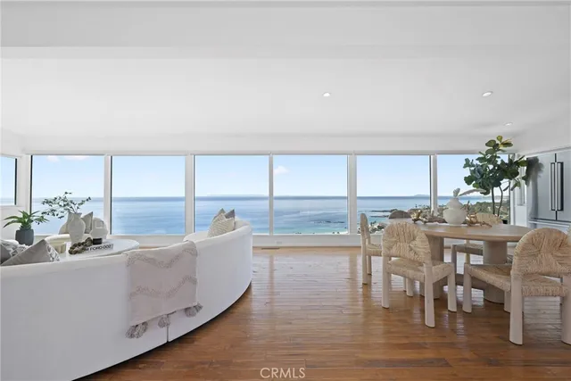 a living room with furniture a window and a dining table