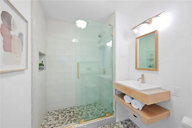 a bathroom with a sink and a mirror