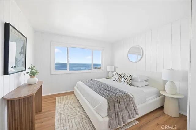 a bedroom with a large bed and a couch