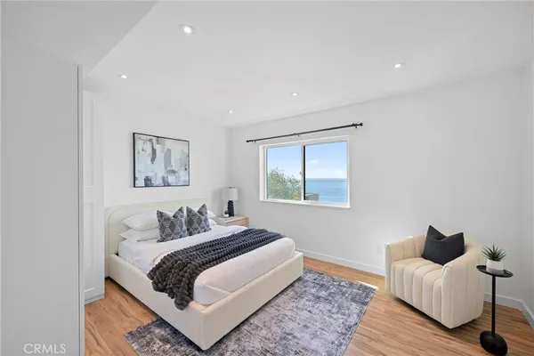 a bedroom with bed and furniture