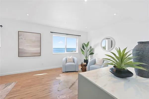a view of kitchen with furniture and potted plants