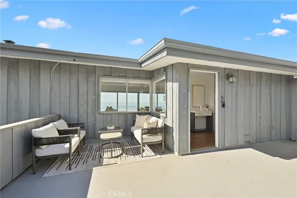 a bedroom with furniture and window