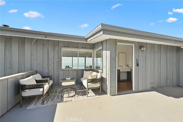 a bedroom with furniture and window