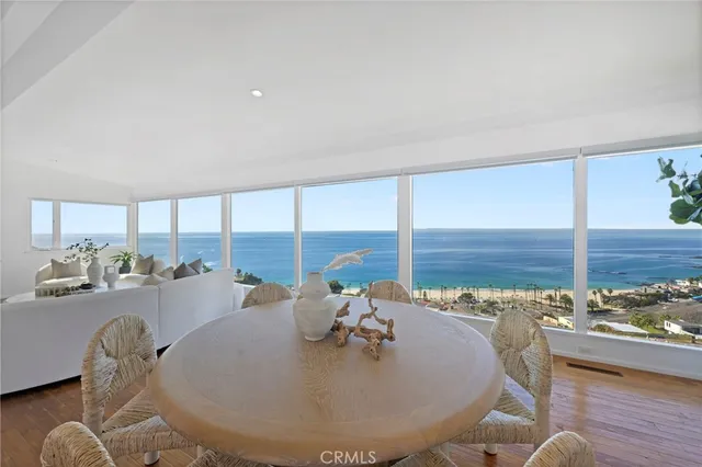 a very nice looking dining room with a large window