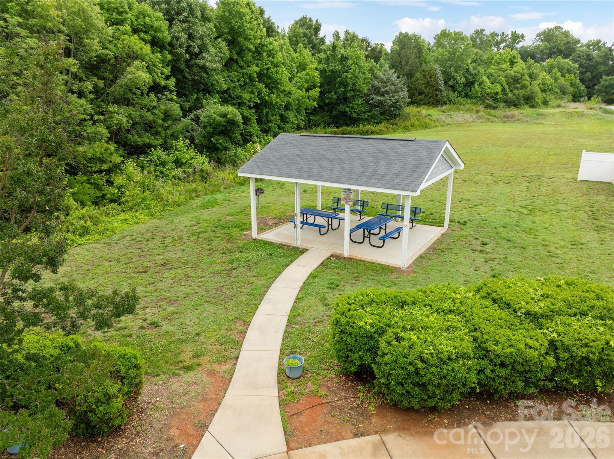 8726 Conrad Street Locust, NC 28097 - Photo 34 of 36 a view of a house with a yard