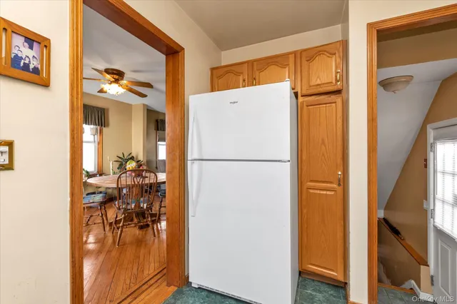 a view of hallway with livingroom and furniture