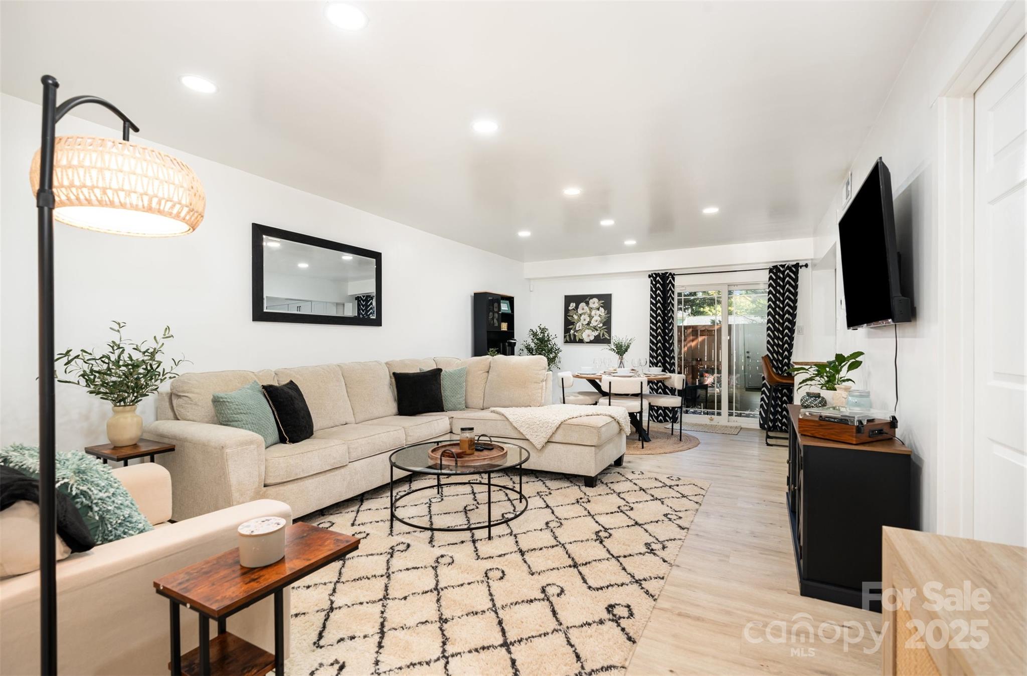 1635 Merry Oaks Road Charlotte, NC 28205 - Photo 1 of 15 a living room with furniture and a flat screen tv