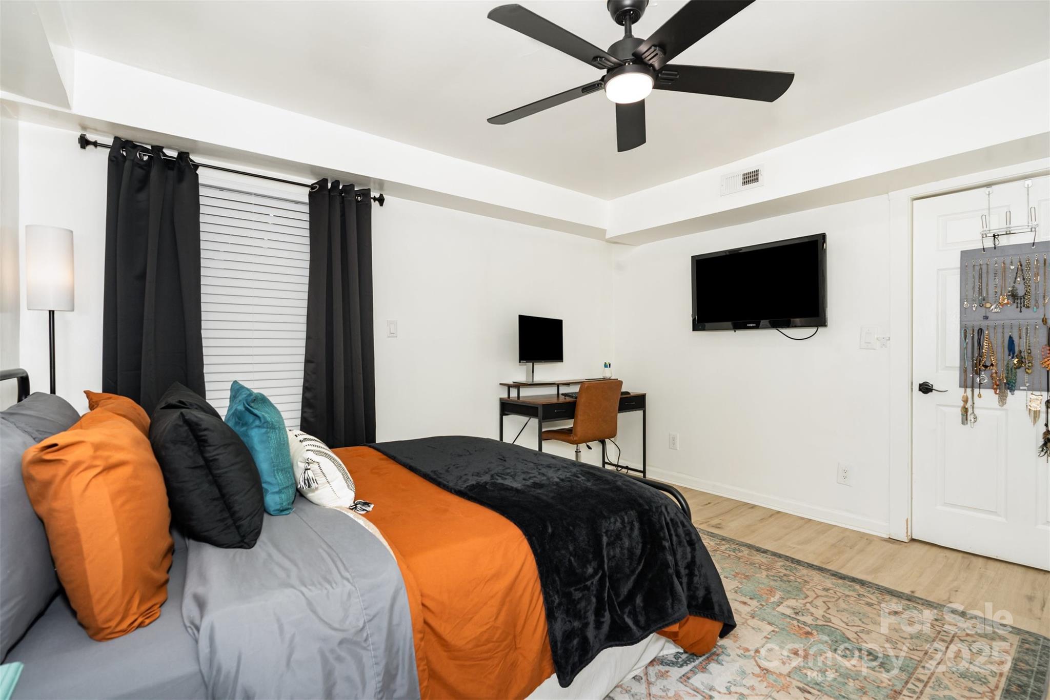 1635 Merry Oaks Road Charlotte, NC 28205 - Photo 11 of 15 a bedroom with a bed and a flat screen tv