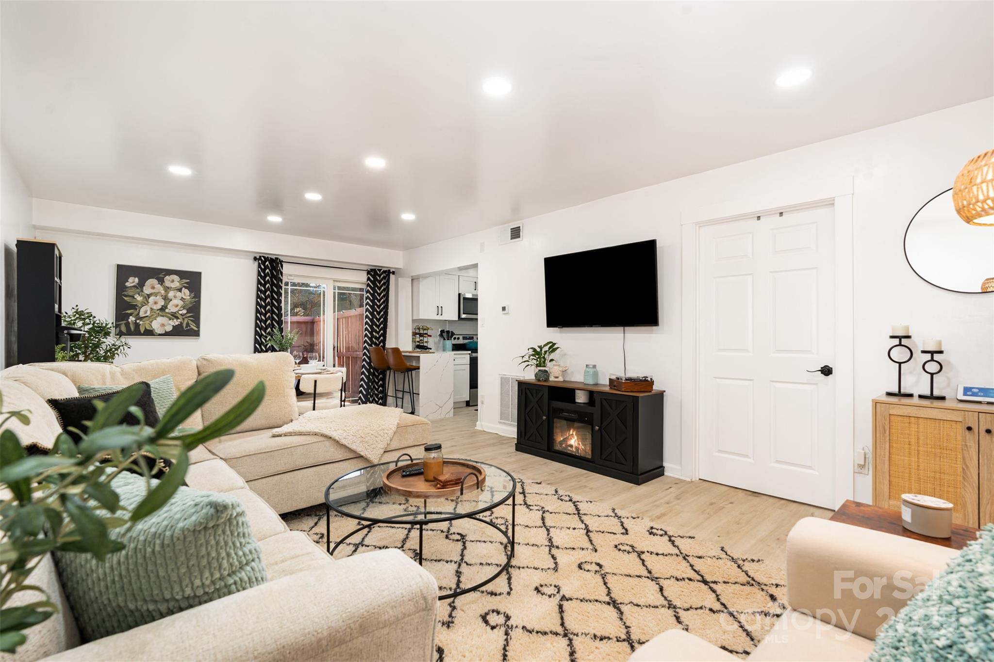 1635 Merry Oaks Road Charlotte, NC 28205 - Photo 2 of 15 a living room with furniture and a flat screen tv