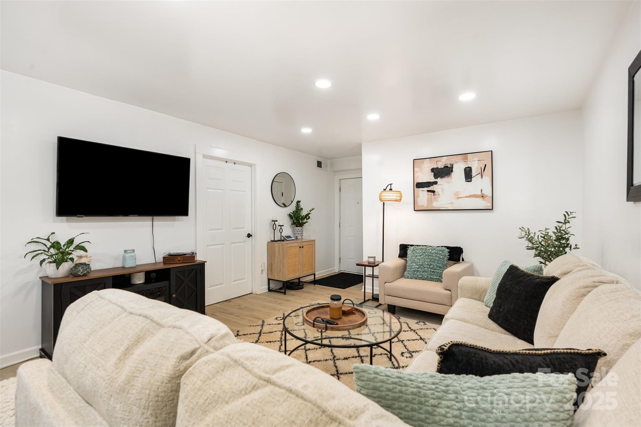 1635 Merry Oaks Road Charlotte, NC 28205 - Photo 3 of 15 a living room with furniture and a flat screen tv