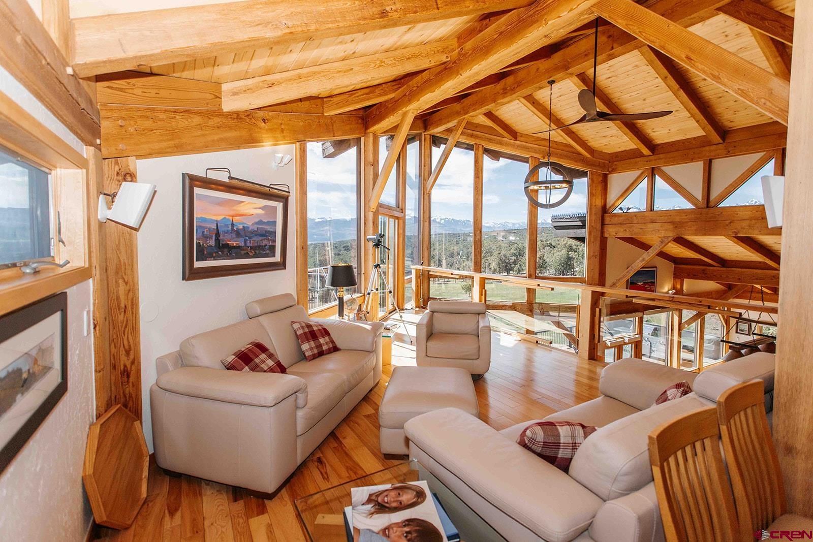 2118 Silverhorn Trail Ridgway, CO 81432 - Photo 19 of 35 a living room with furniture and a floor to ceiling window