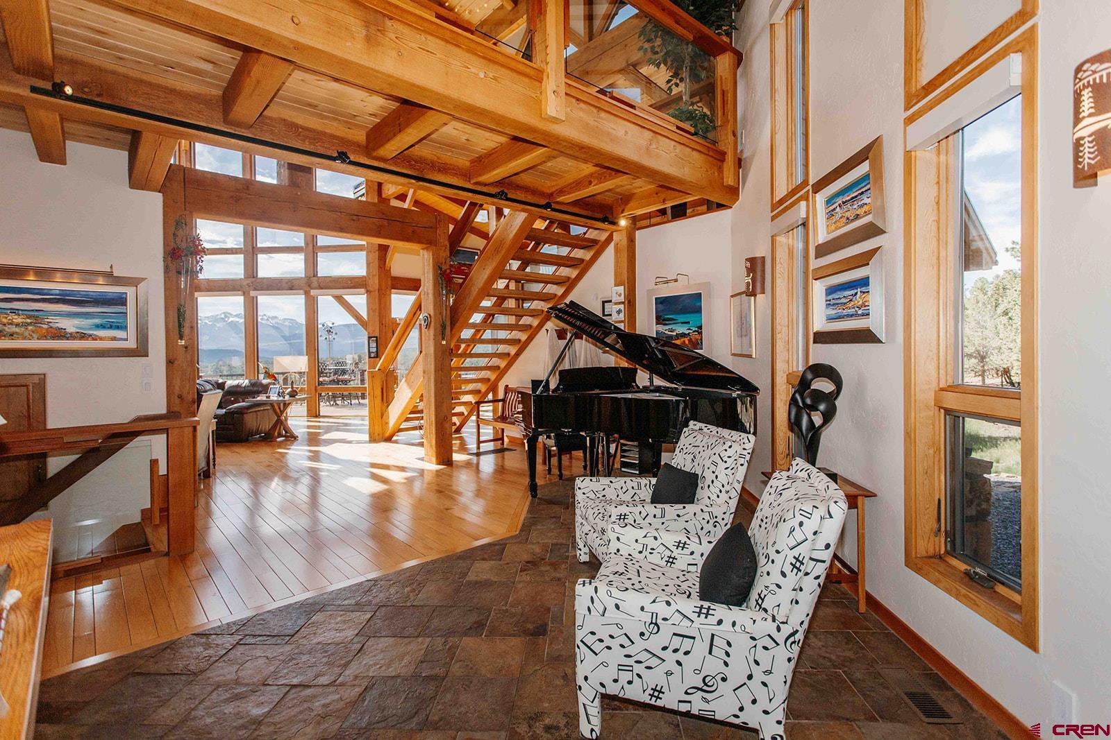 2118 Silverhorn Trail Ridgway, CO 81432 - Photo 20 of 35 a living room with furniture and a floor to ceiling window