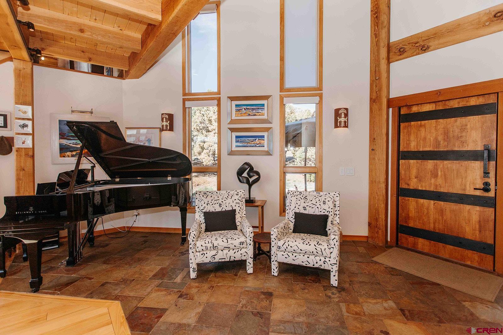 2118 Silverhorn Trail Ridgway, CO 81432 - Photo 21 of 35 a living room with furniture and a window