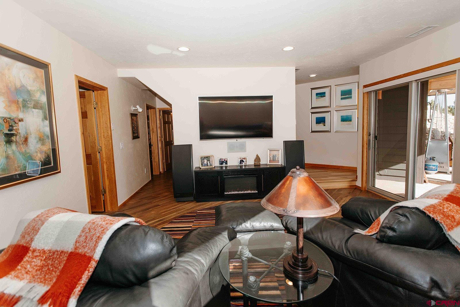 2118 Silverhorn Trail Ridgway, CO 81432 - Photo 26 of 35 a living room with furniture and a flat screen tv