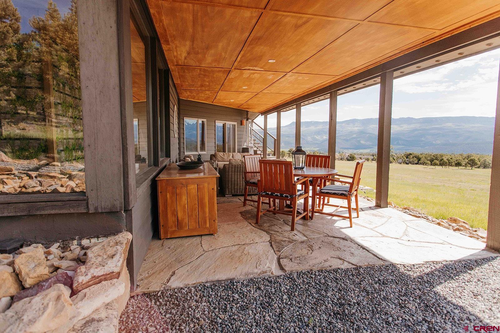 2118 Silverhorn Trail Ridgway, CO 81432 - Photo 28 of 35 a outdoor space with lots of tables a couch and chairs