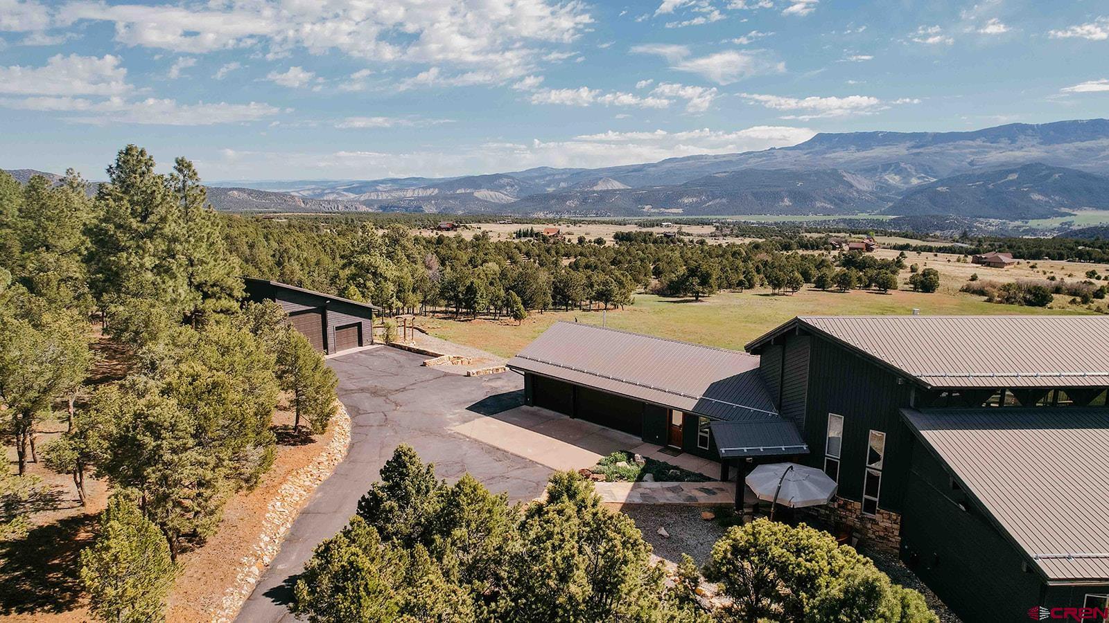 2118 Silverhorn Trail Ridgway, CO 81432 - Photo 9 of 35 a view of a terrace with a table and chairs