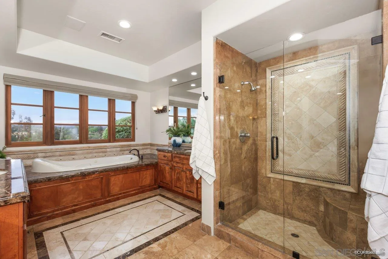 5530 Codorniz Rancho Santa Fe, CA 92067 - Photo 17 of 37 a spacious bathroom with a shower and a bathtub