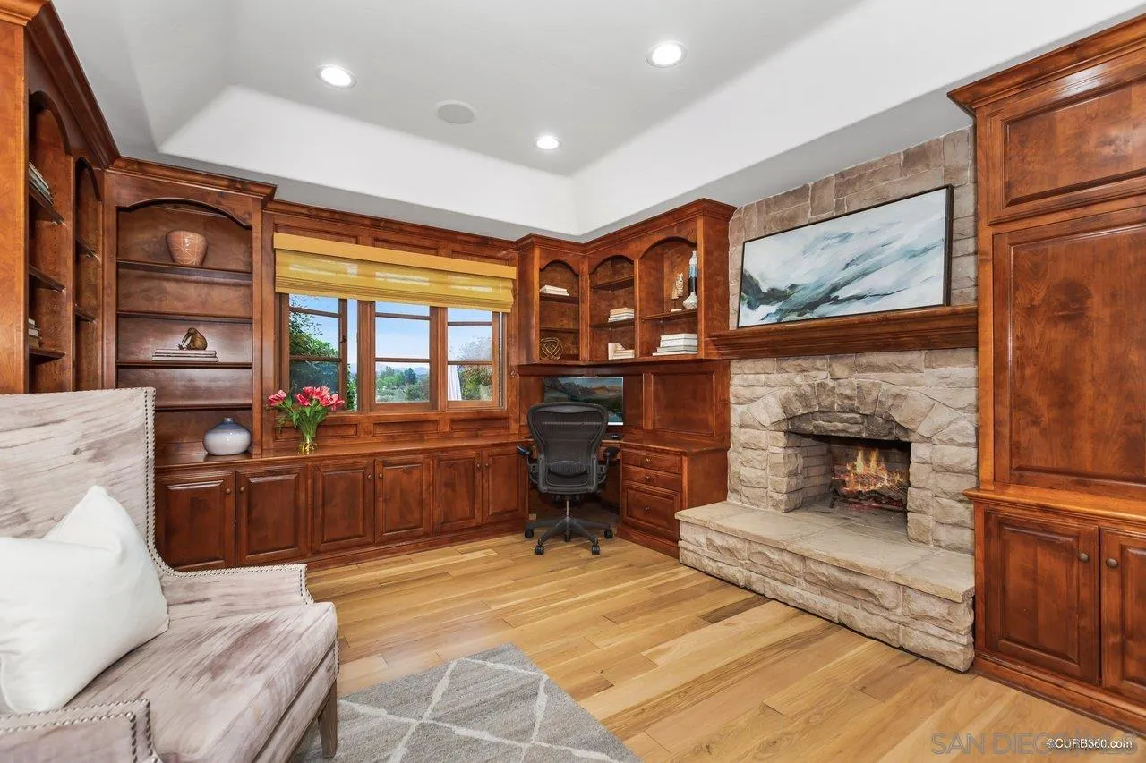 5530 Codorniz Rancho Santa Fe, CA 92067 - Photo 18 of 37 a living room with furniture and a fireplace