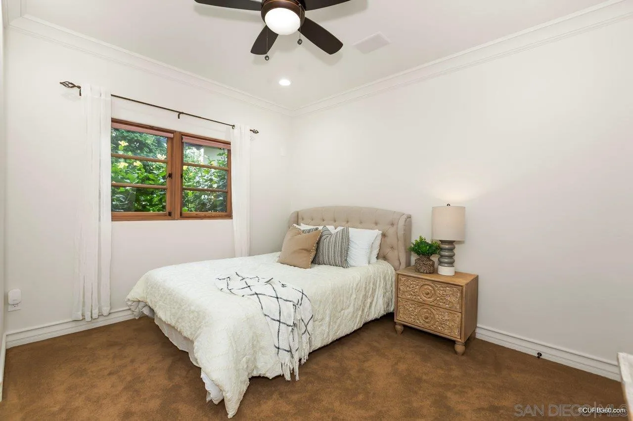 5530 Codorniz Rancho Santa Fe, CA 92067 - Photo 20 of 37 a bedroom with a bed dresser and a window