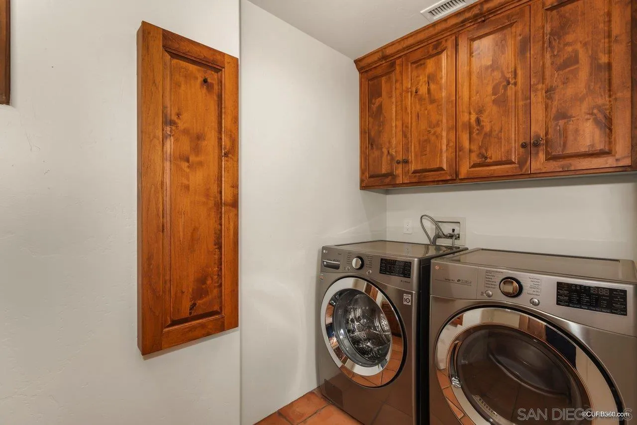 5530 Codorniz Rancho Santa Fe, CA 92067 - Photo 23 of 37 a utility room with dryer and washer